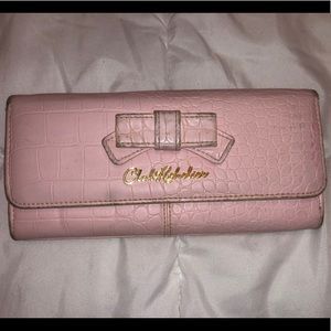 Pink wallet with gold accents